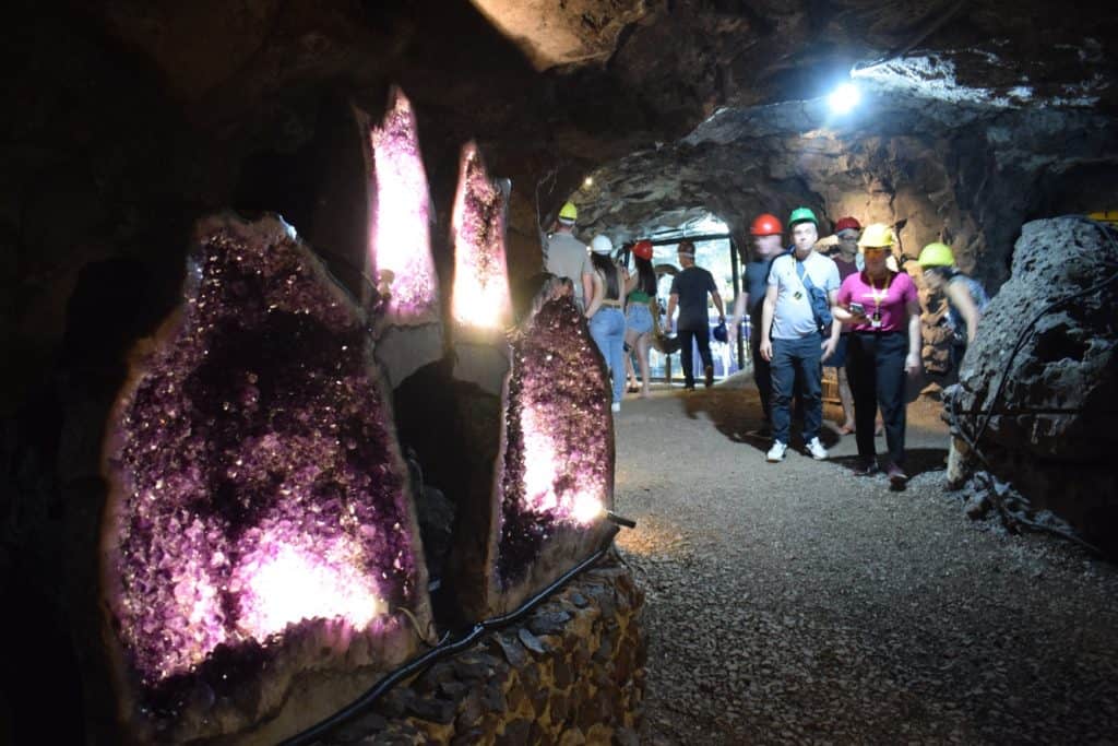 Experience amethyst geodes and explore former mine tunnels